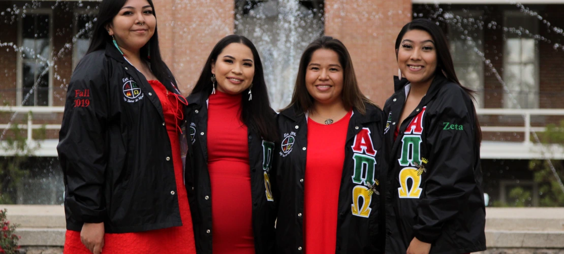 A group photo of members of Alpha Pi Omega Sorority, Inc. 