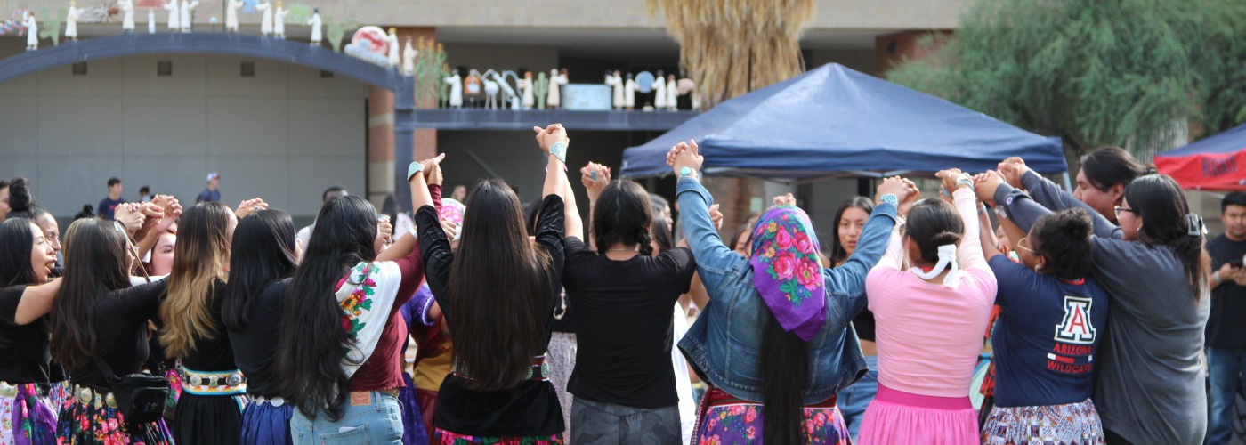 Native students at the University of Arizona participating in a round dance on the Uarizona Mall