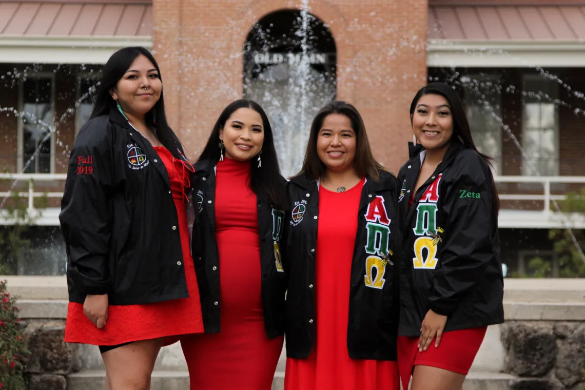 A group photo of members of Alpha Pi Omega Sorority, Inc. 